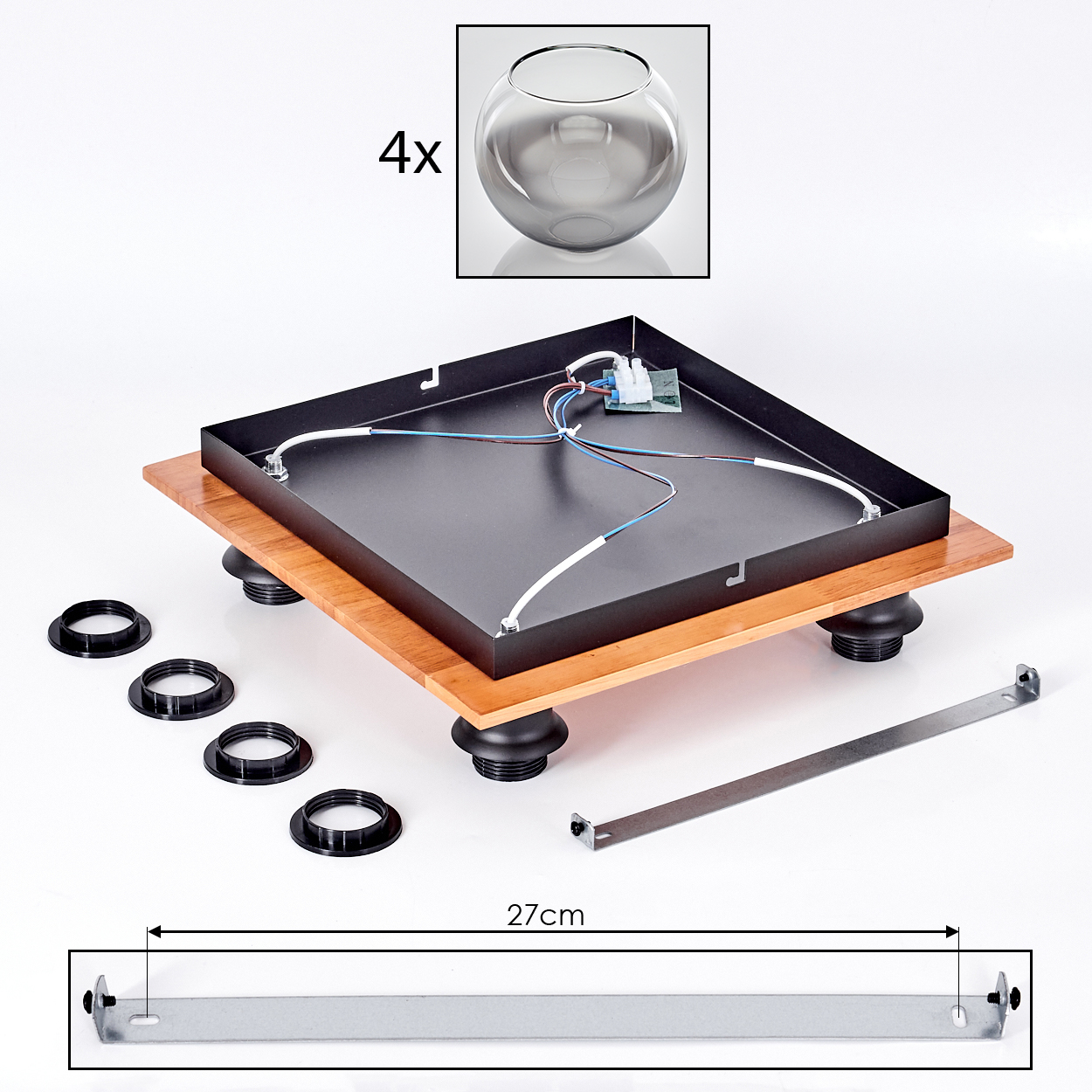 Bauteile für ein Gerät: Holzbasis, Metallgehäuse, Füße, Ringe, Metallstreifen.