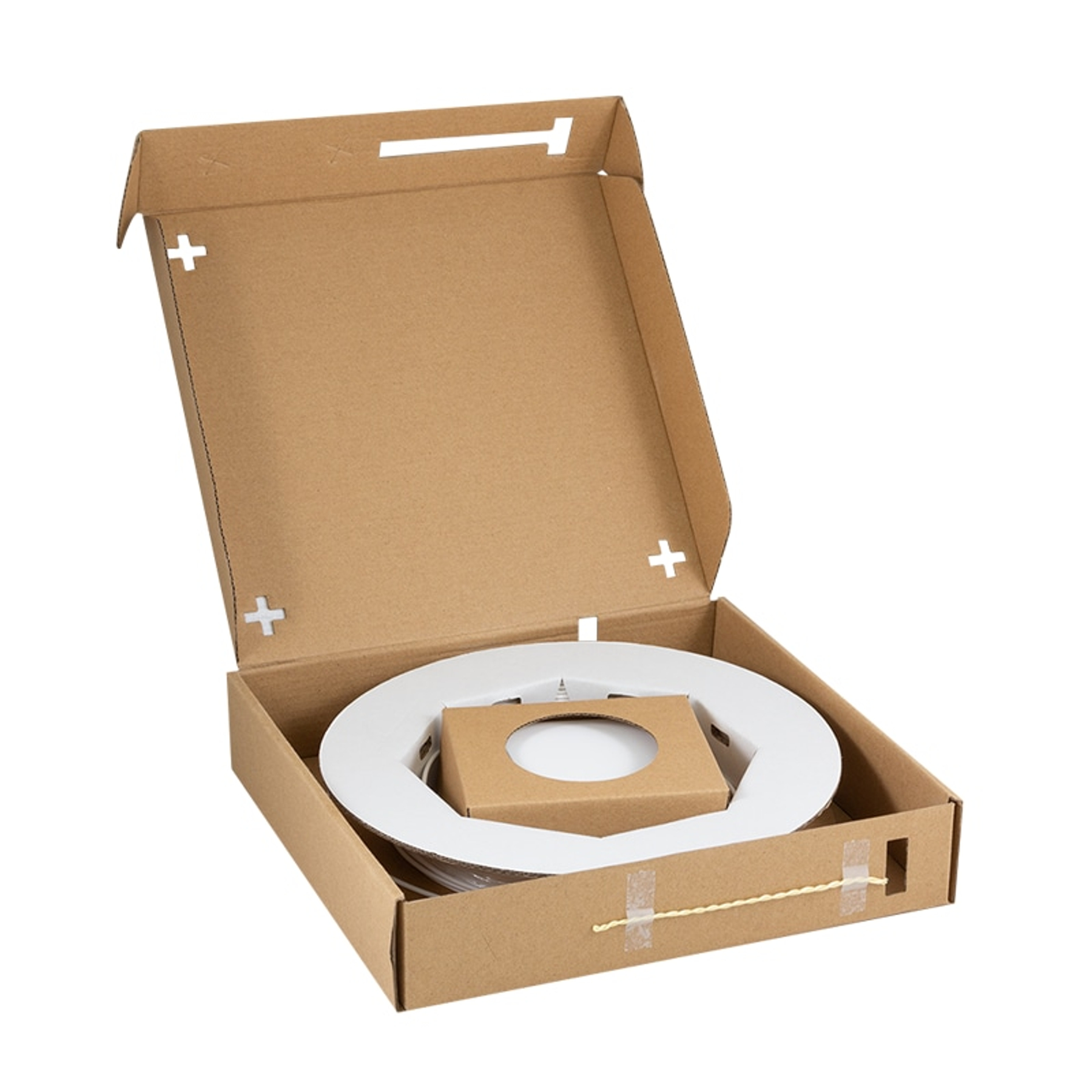Una scatola di cartone aperta con un oggetto circolare bianco e imballaggio marrone.