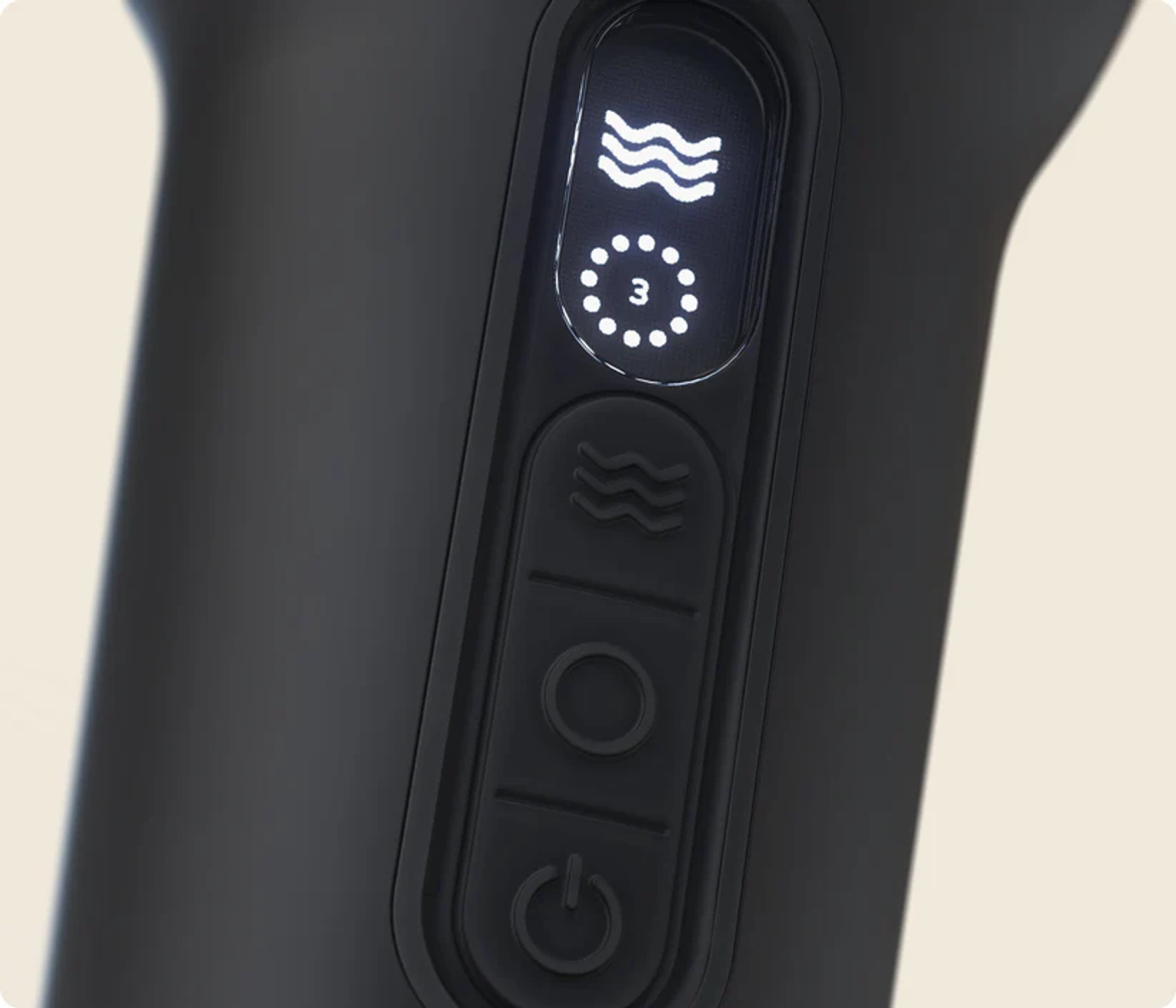 Primer plano de botones en un dispositivo negro, con icono de onda e '3' iluminados.