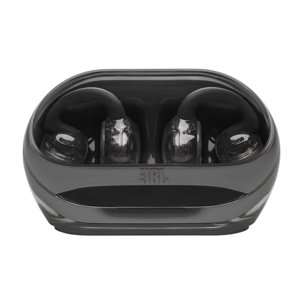 Szare słuchawki z przezroczystymi końcówkami w etui ładującym z logo JBL.