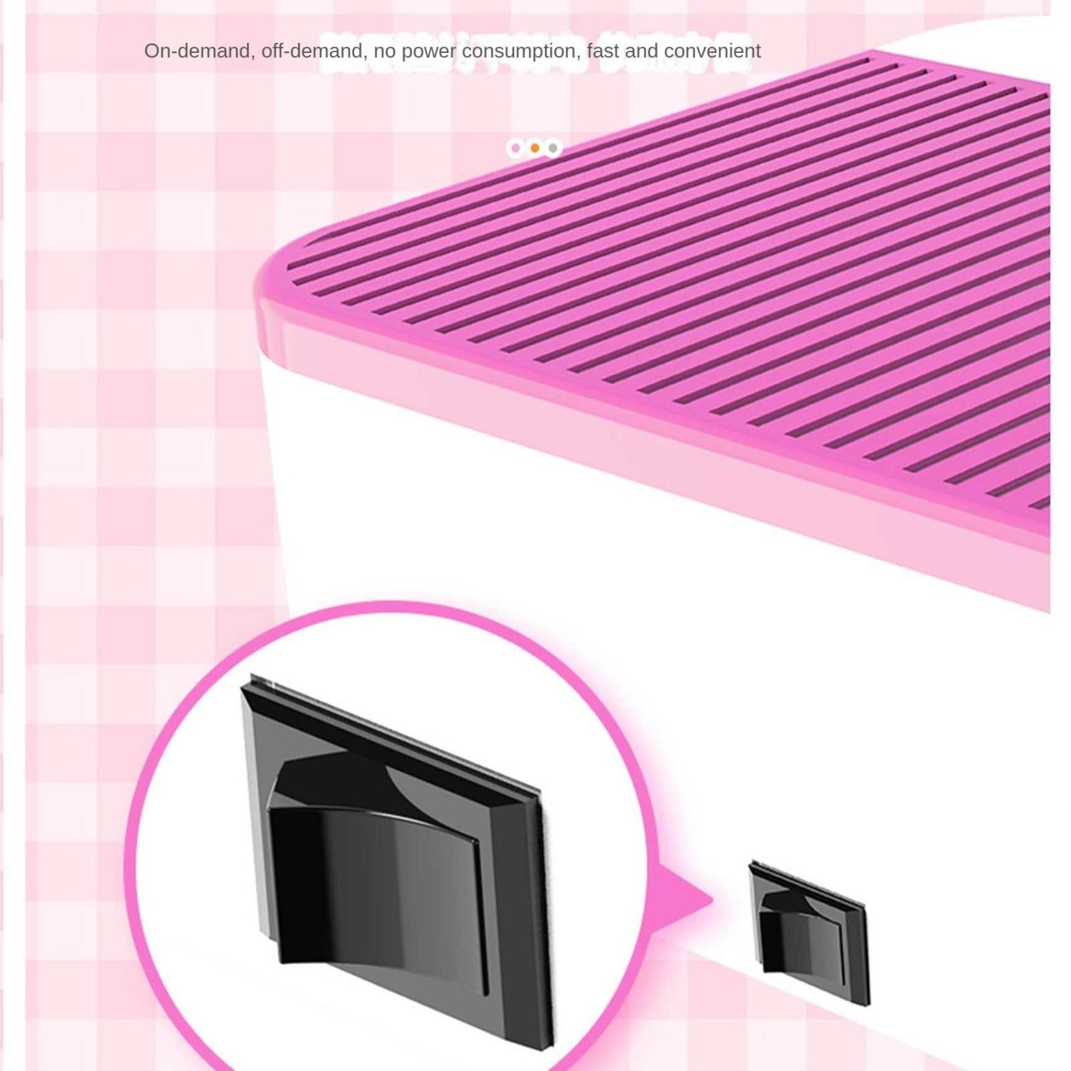 Ein rosa und weißes Gerät mit einem schwarzen Aufsatz.