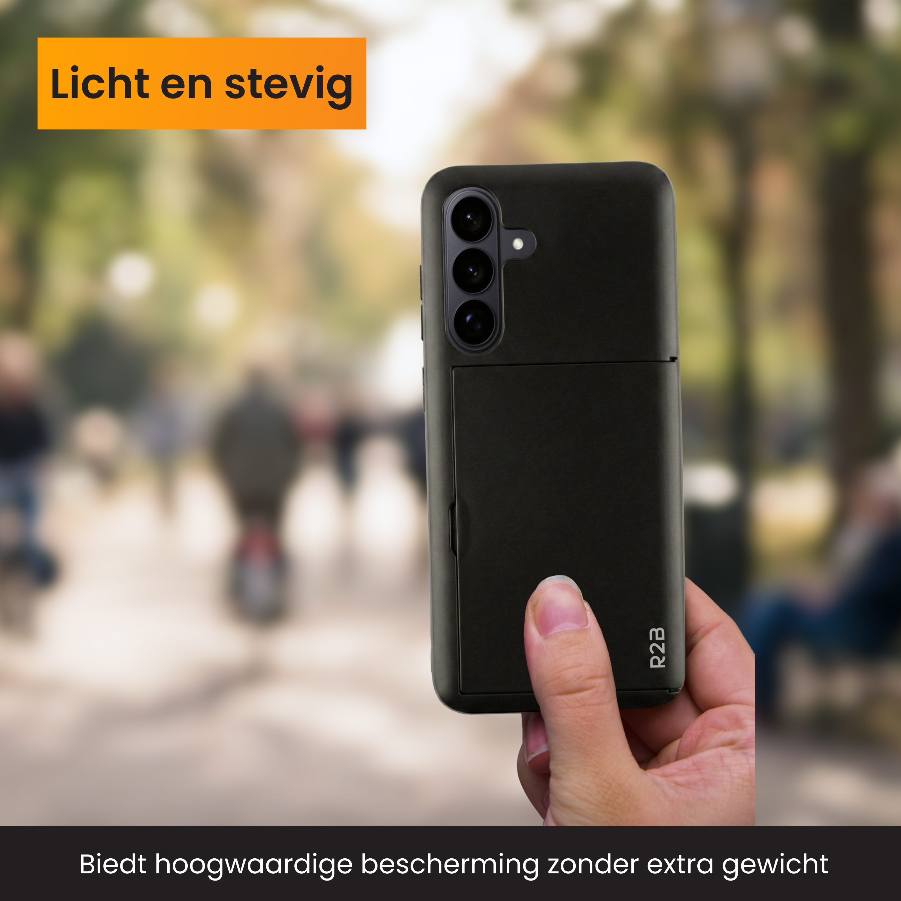 A hand holds a black phone case, with a blurred background of people.