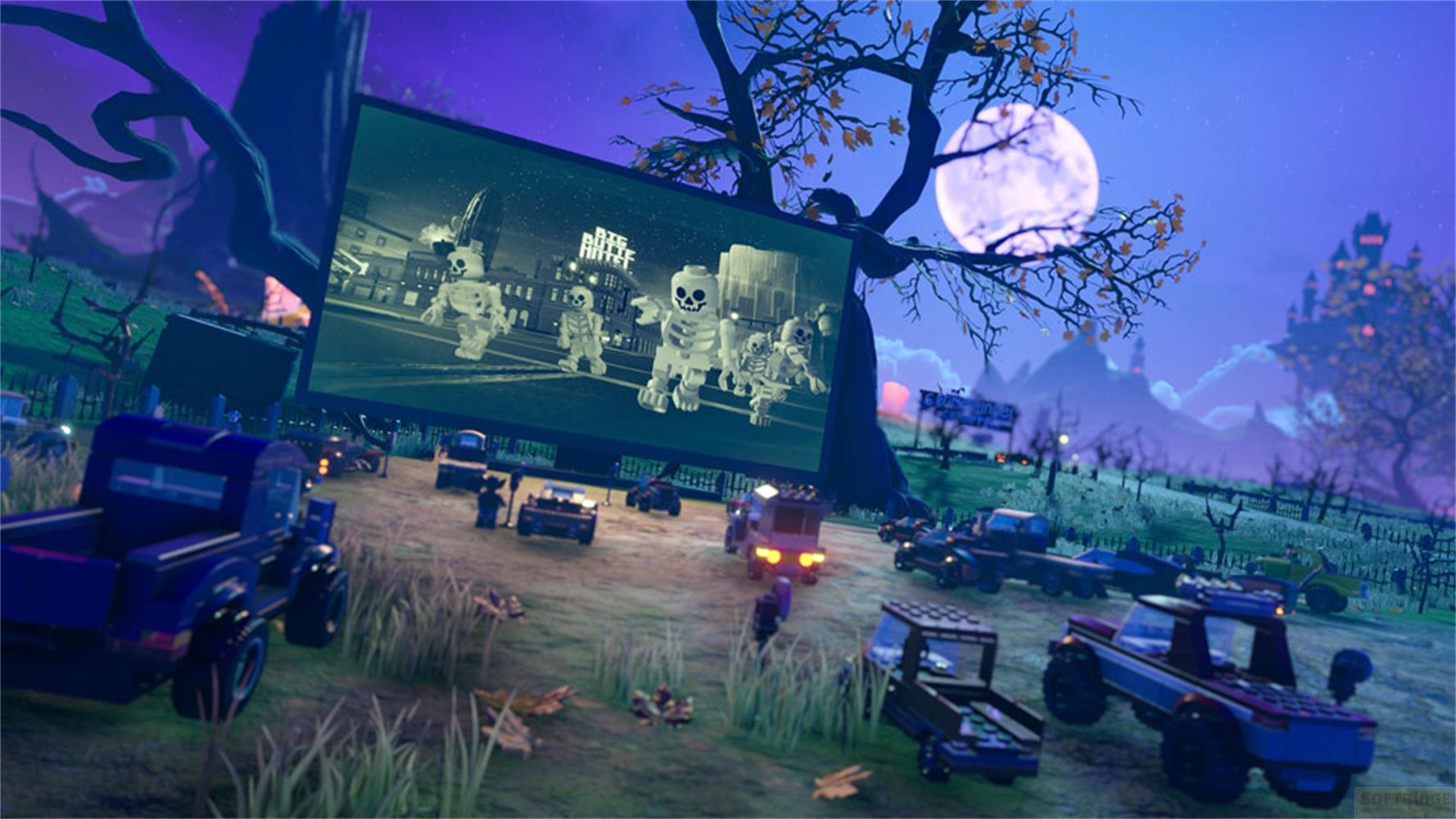 Cinéma de plein air nocturne avec des squelettes Lego à l'écran et des voitures.