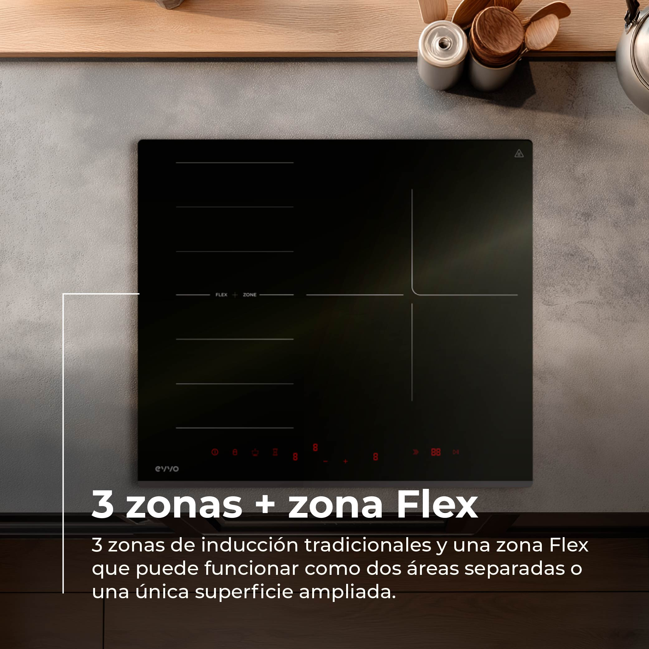 Placa de inducción negra con zona flexible y utensilios de cocina.