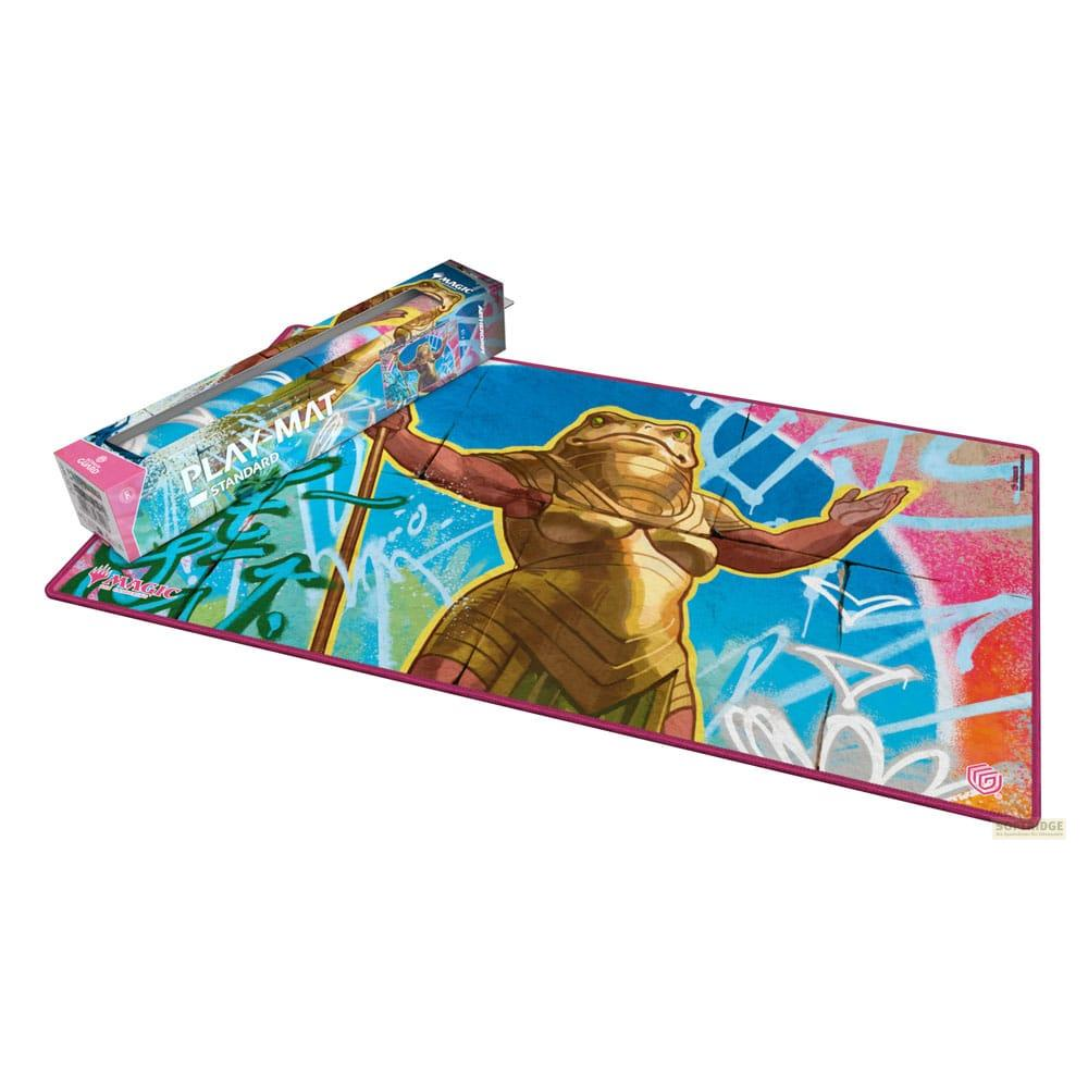 Spielmatte mit einer goldenen Froschfigur und Graffiti-Hintergrund.