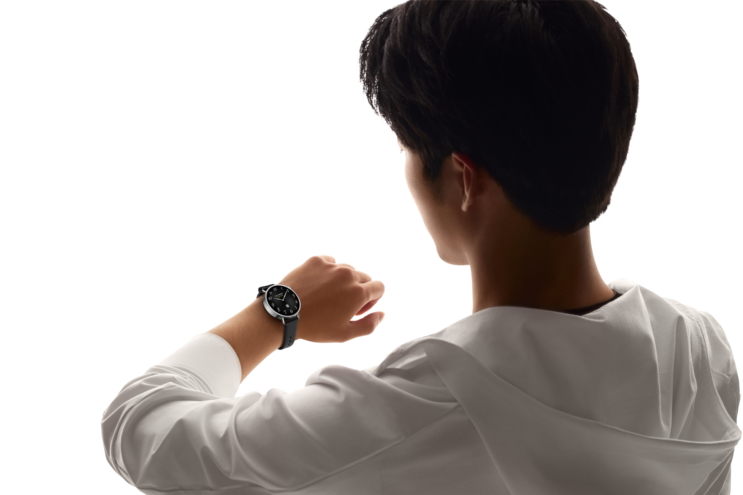 Man wearing a wristwatch, seen from behind, against white.