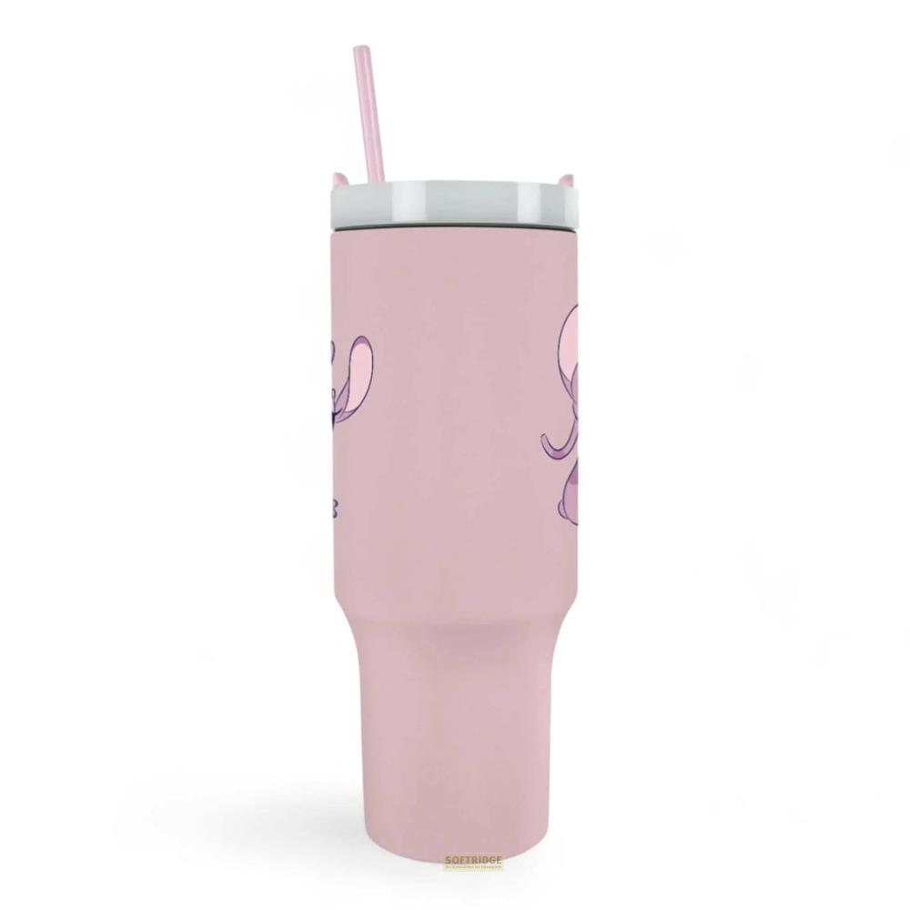 Un vaso rosa con pajita rosa y diseño de elefante.