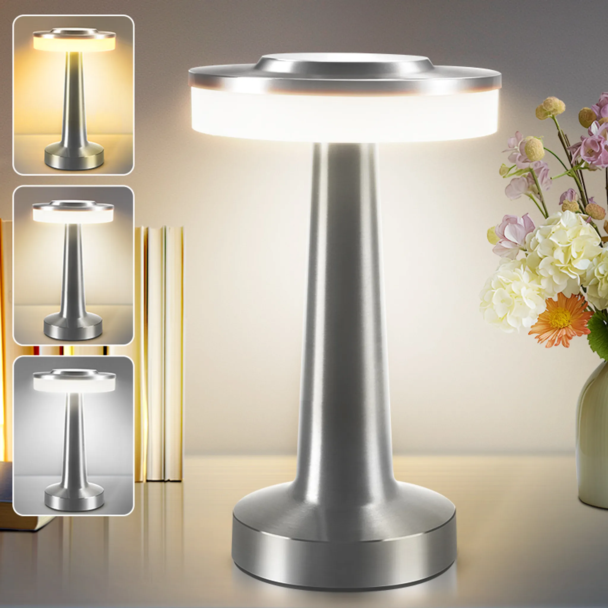 Eine moderne silberne Nachttischlampe mit hellweißer Beleuchtung, daneben Blumen.