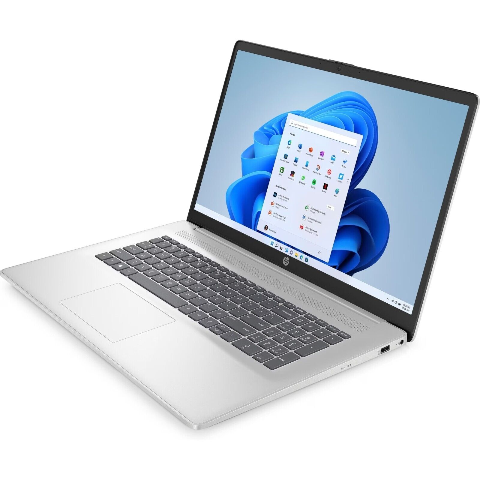 Ein silberner Laptop mit eingeschaltetem Bildschirm, der das Windows 11 Startmenü anzeigt.