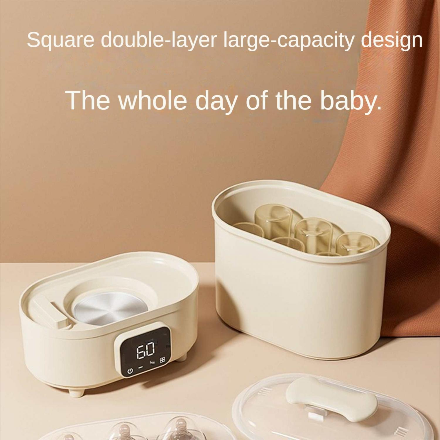Ein Babyflaschenwärmer und Sterilisator auf einem Tisch.