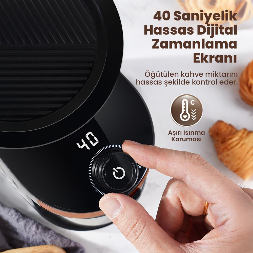 Bir parmak, 40 gösteren dijital zamanlayıcıda bir düğmeyi çeviriyor. Aşırı ısınma koruması simgesi.
