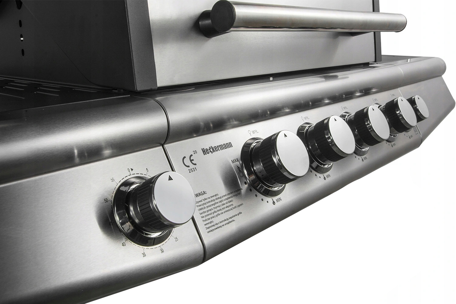 Grill ze stali nierdzewnej z pokrętłami i skalą temperatury.