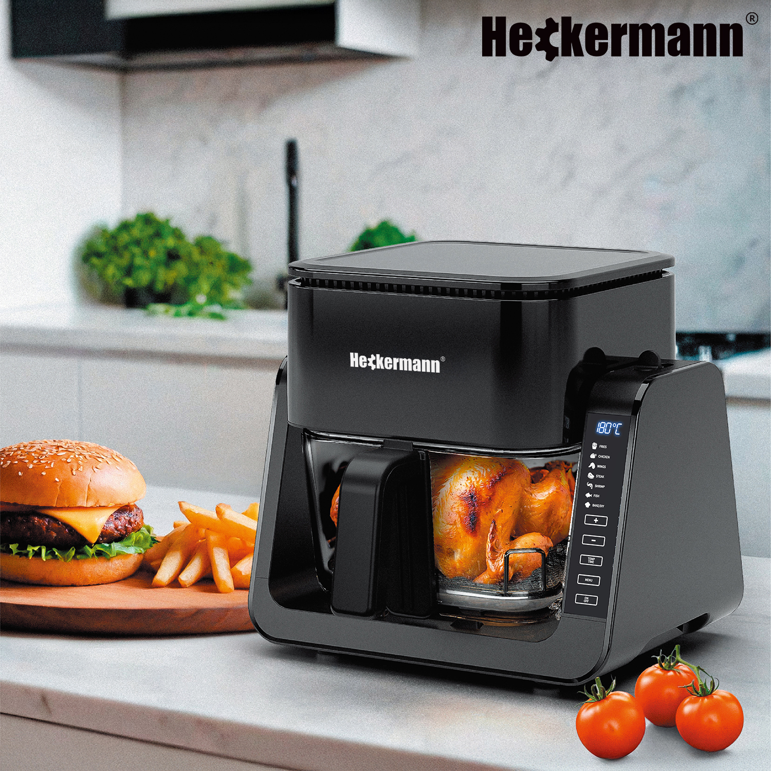 Czarna frytkownica beztłuszczowa z pieczonym kurczakiem, burgerem, frytkami i pomidorami.