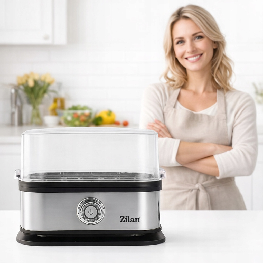 Kobieta w fartuchu stoi za parowarem Zilan w kuchni.