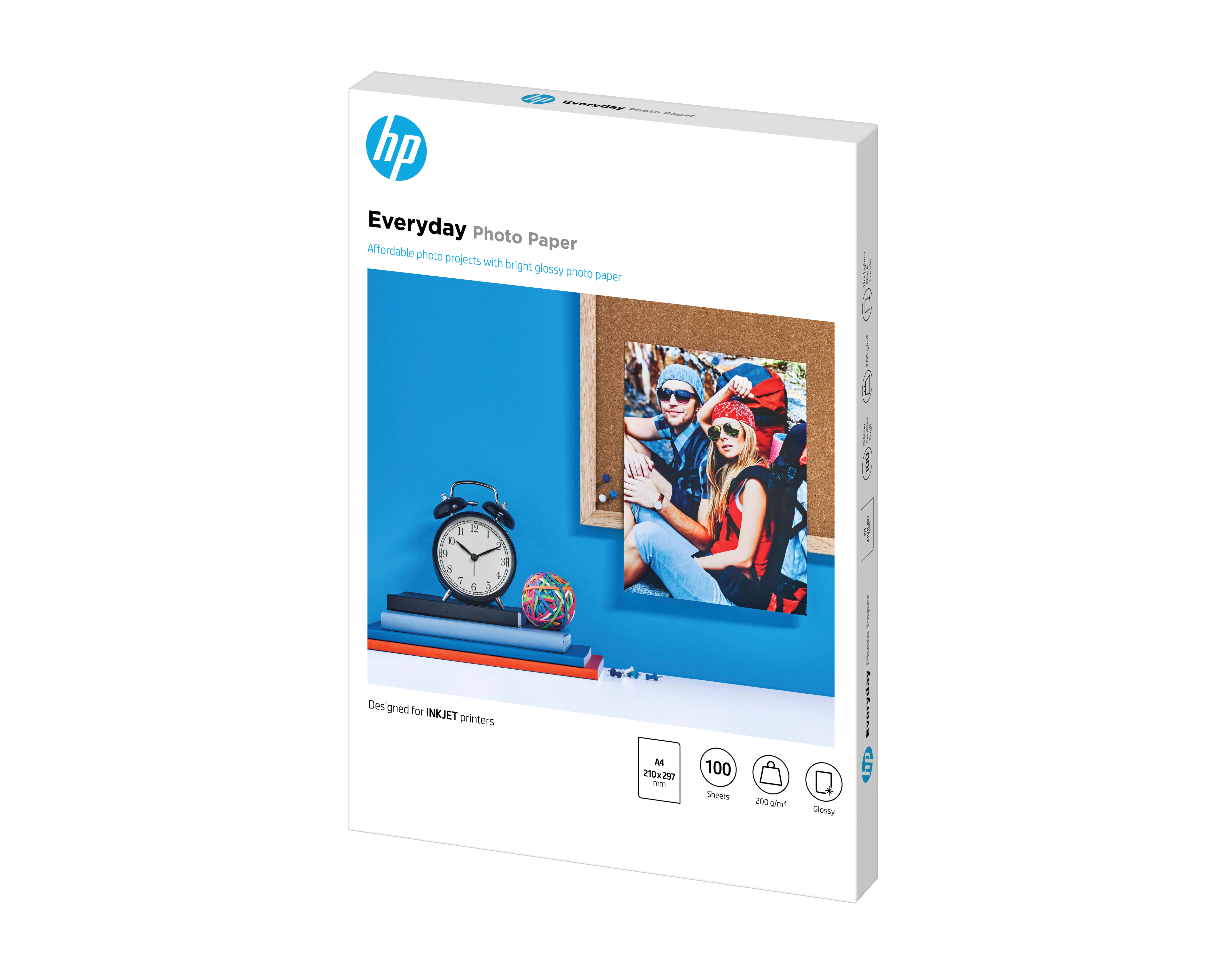Confezione carta fotografica HP Everyday con immagine di una coppia, orologio e cancelleria.