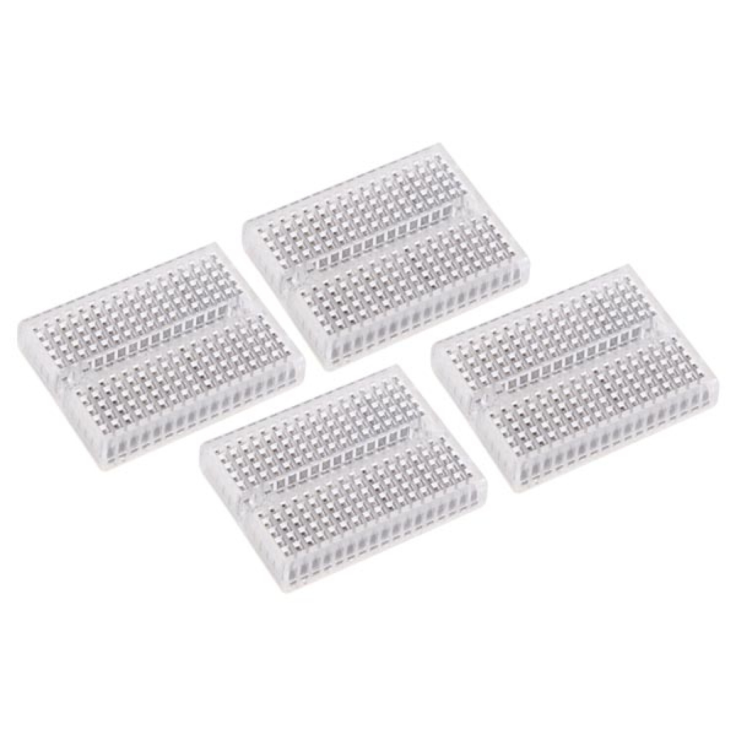 Quattro breadboard trasparenti con punti di saldatura argentati, su sfondo bianco.