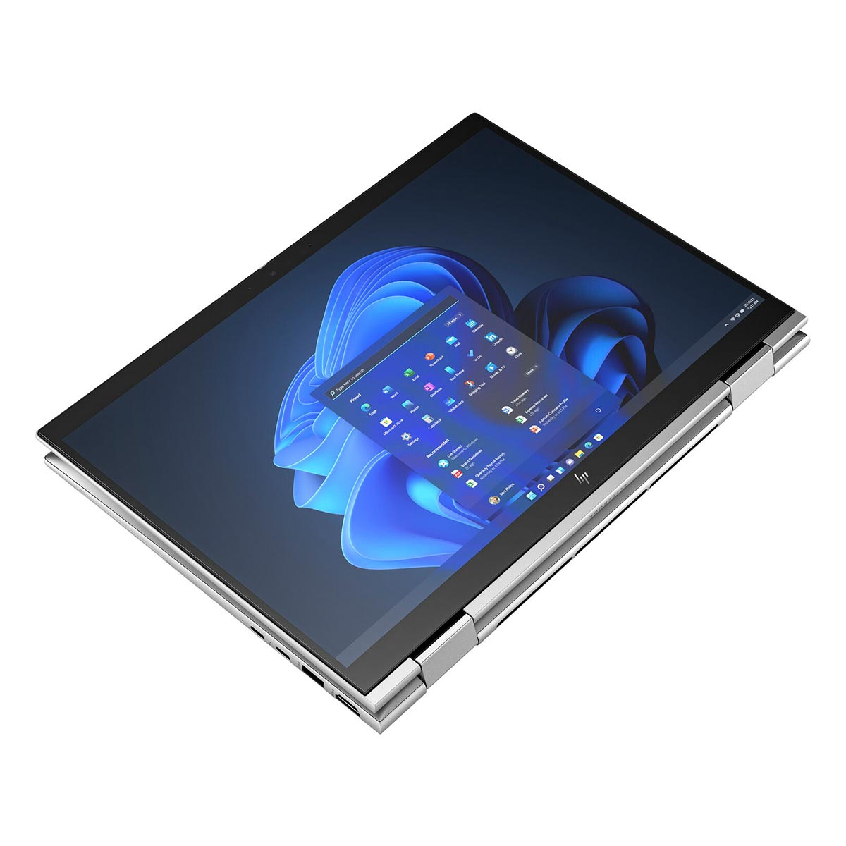 Srebrny laptop z otwartym ekranem, wyświetlający niebieską tapetę pulpitu i ikony aplikacji.