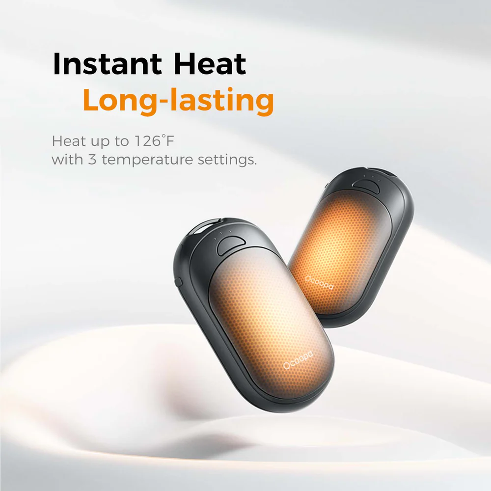 Dwa czarne podgrzewacze do rąk z pomarańczowymi elementami grzewczymi.