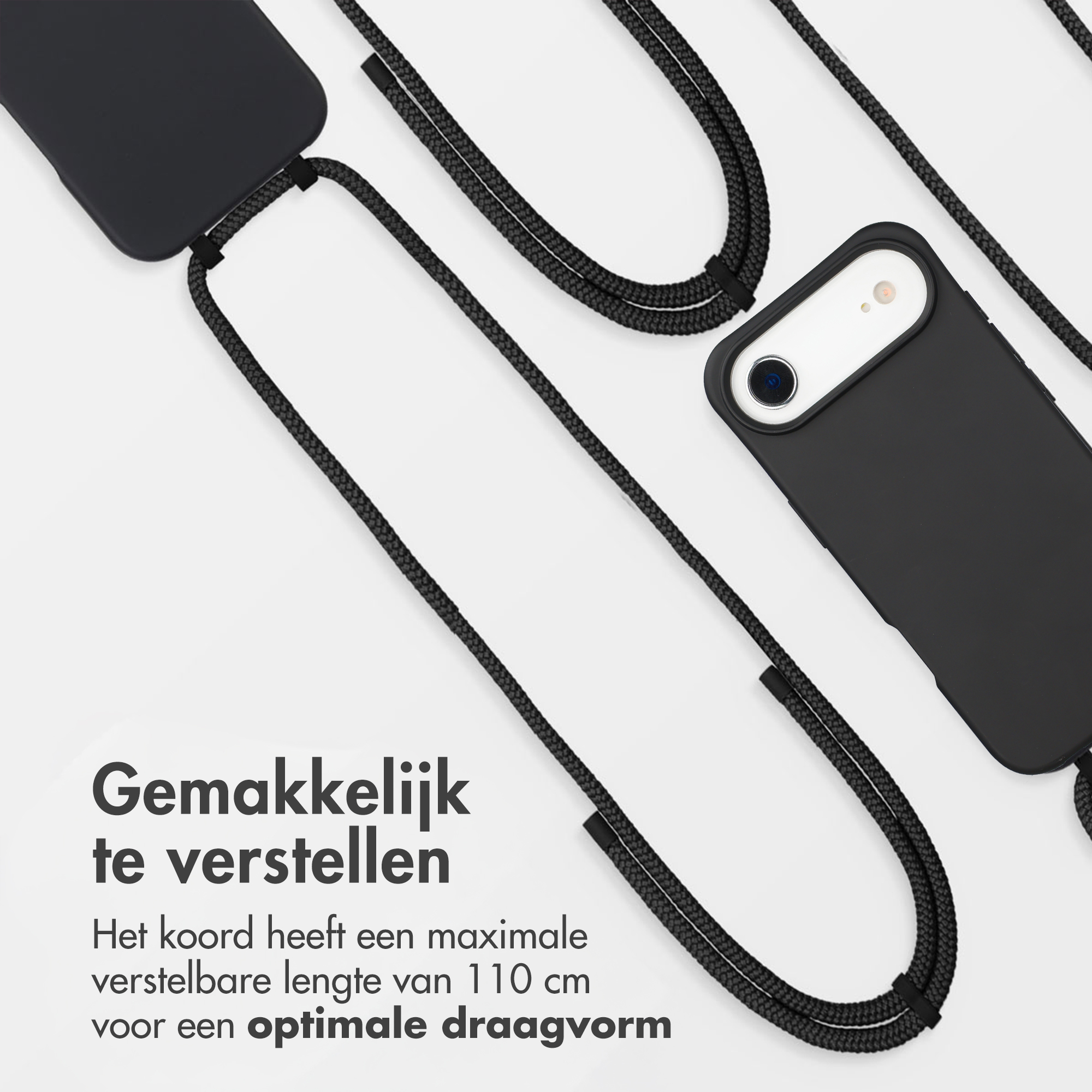 Zwarte telefoon met koord en tekst.