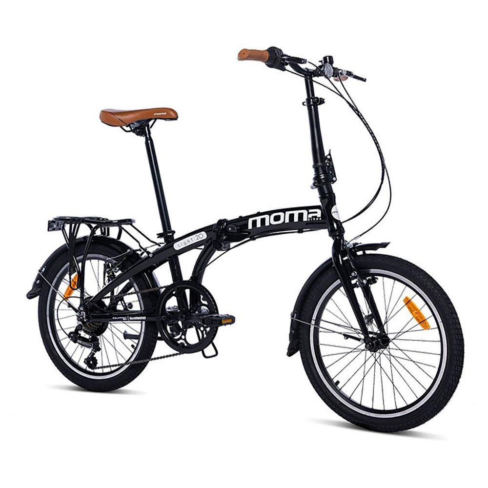 Bicicletta pieghevole nera con sella e manopole marroni, su sfondo bianco.
