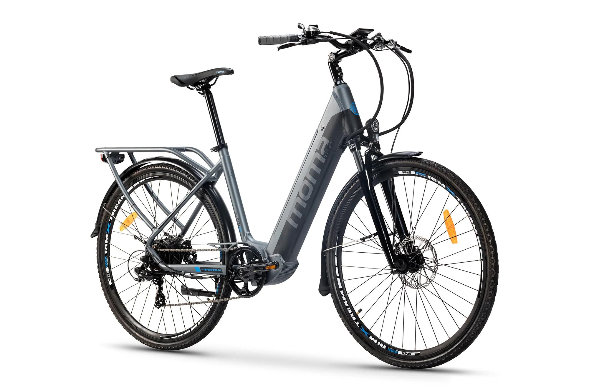 Bicicletta da donna grigia con portapacchi e cambio Shimano, su sfondo bianco.