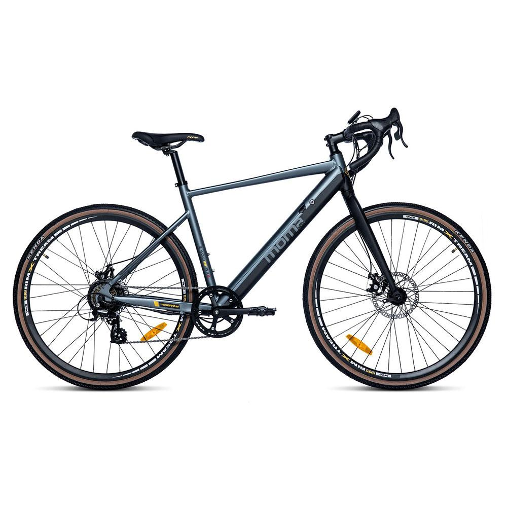Una gravel bike grigia con manubrio da corsa, freni a disco e copertoni marroni.