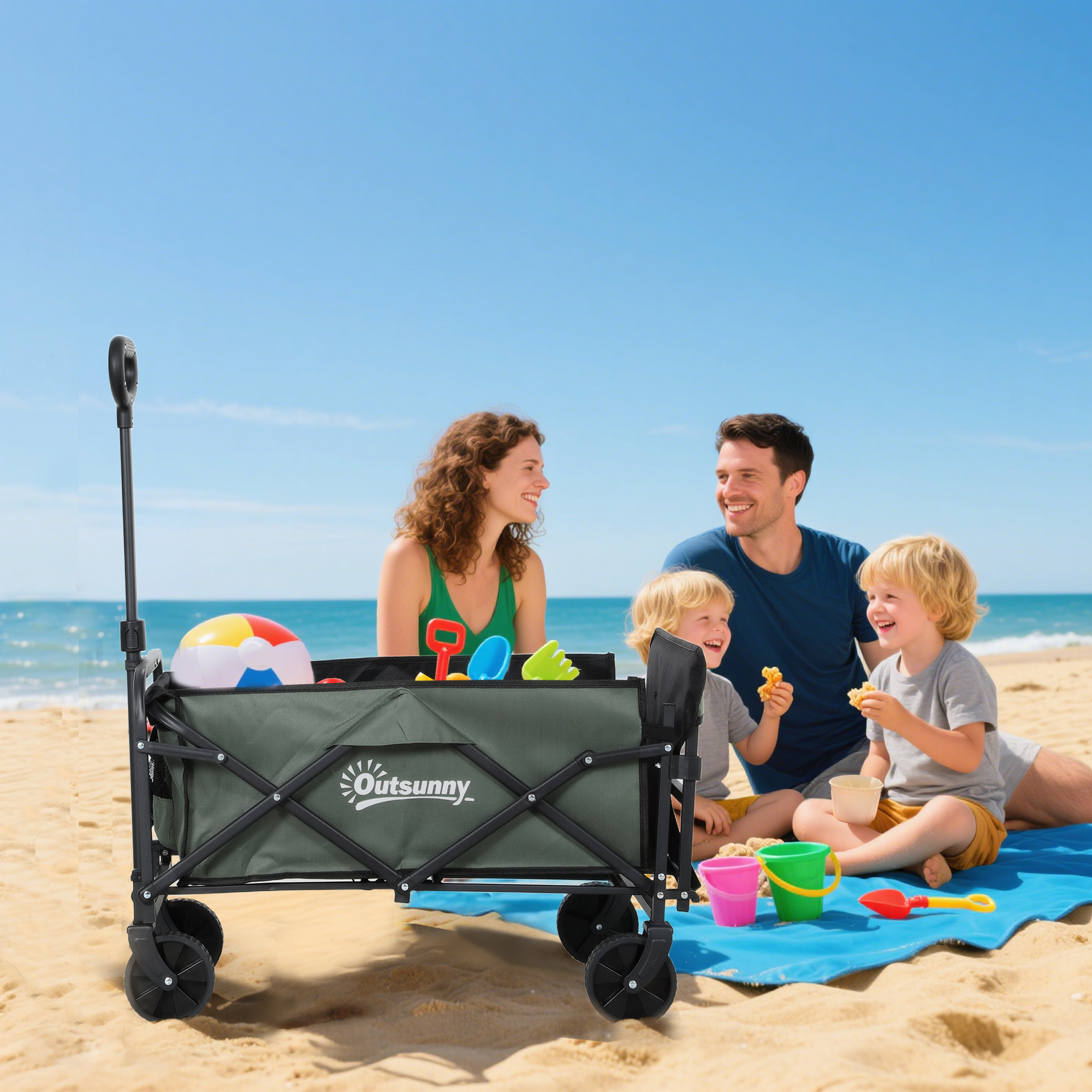 Famiglia in spiaggia con carretto e giocattoli.