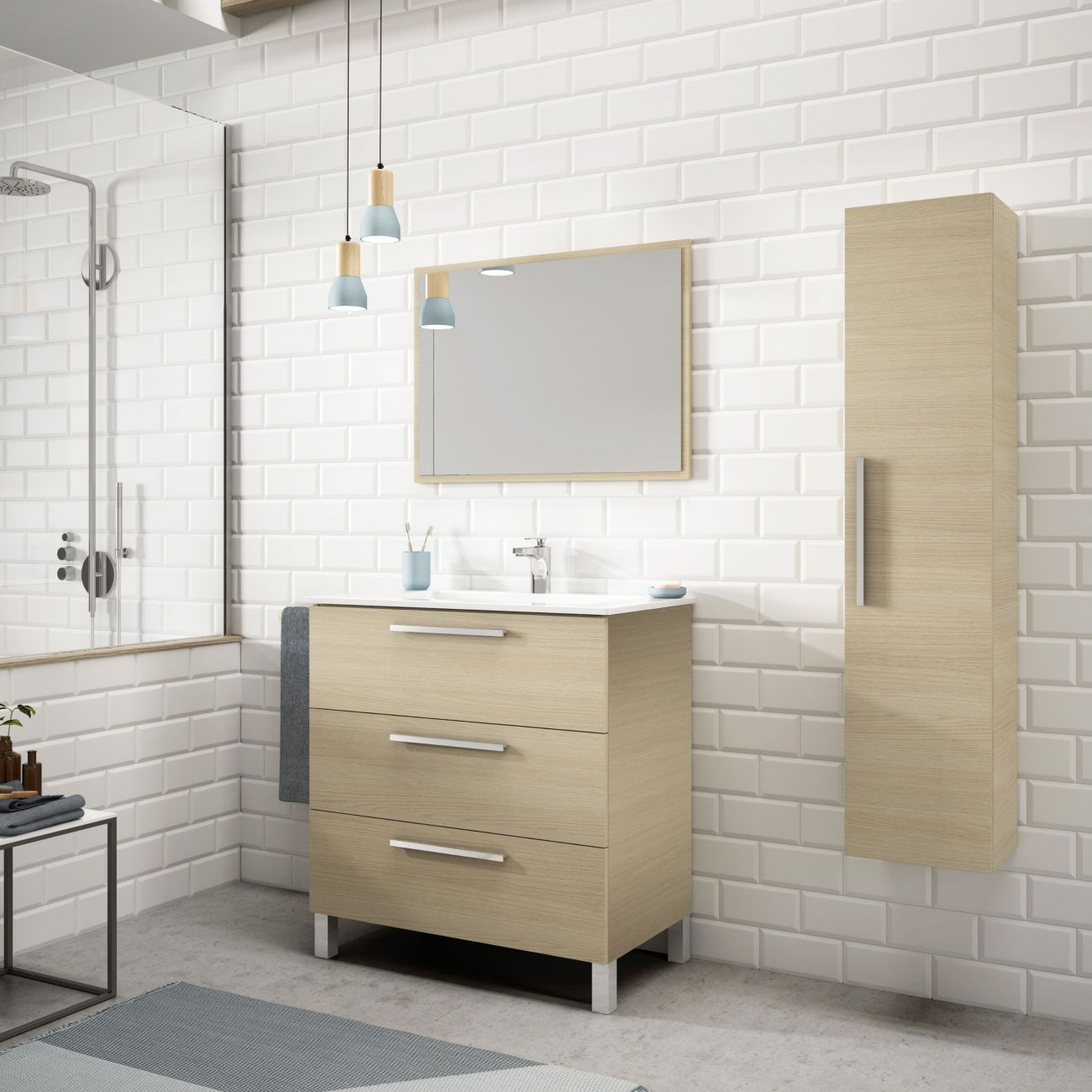 Un baño moderno con azulejos blancos tipo metro, tocador de madera, espejo y armario.