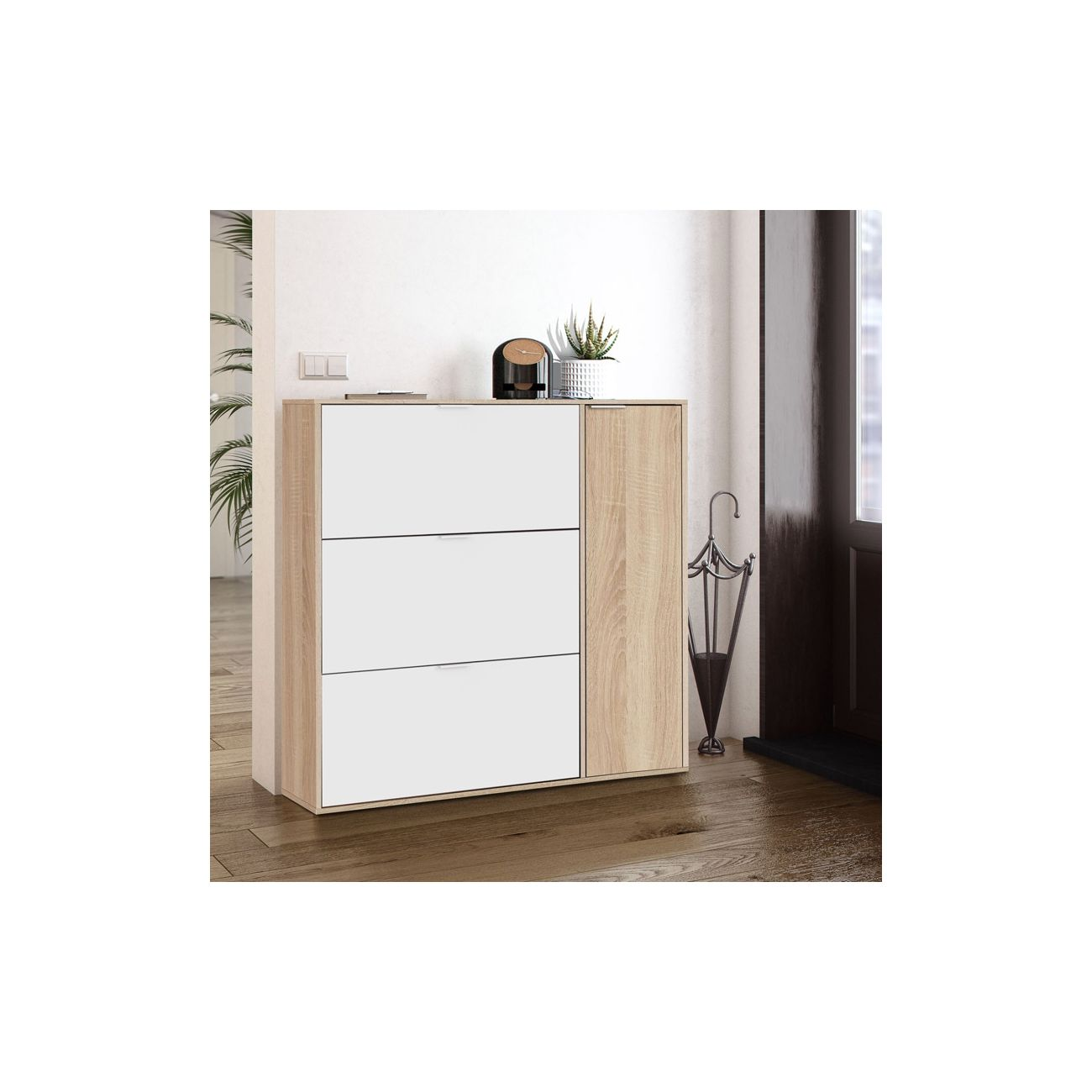 Un armario blanco y de madera con tres cajones y una puerta.