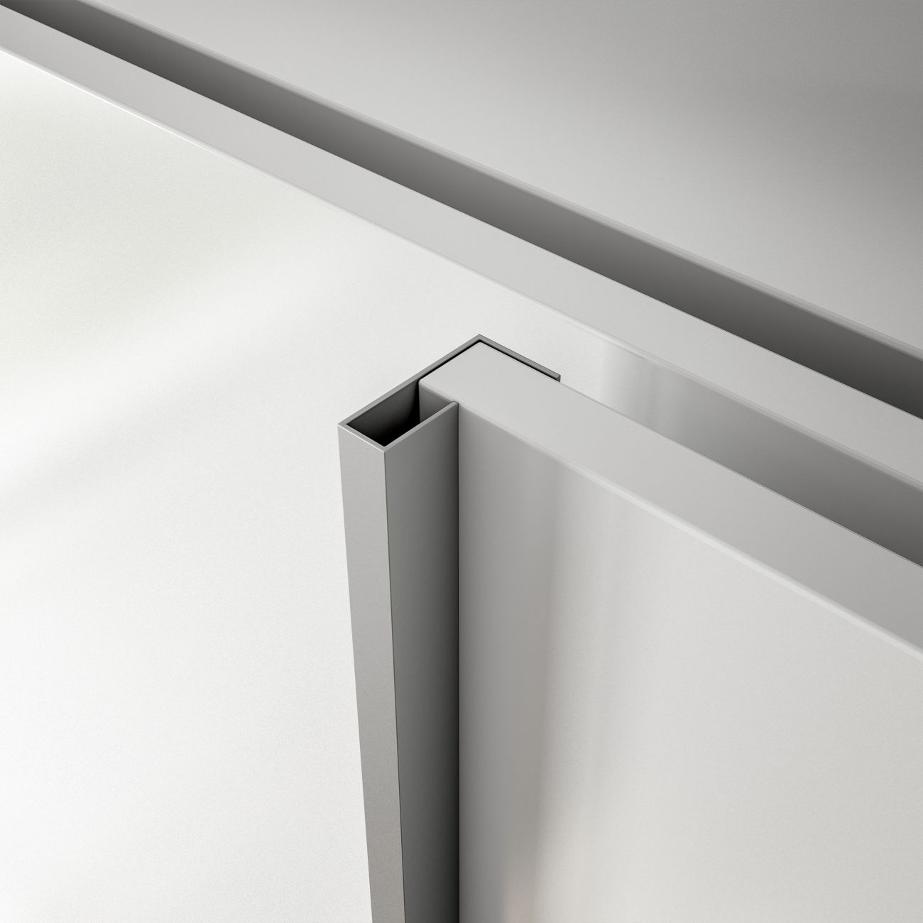 Una esquina de metal plateado conecta dos paneles blancos en un diseño minimalista.