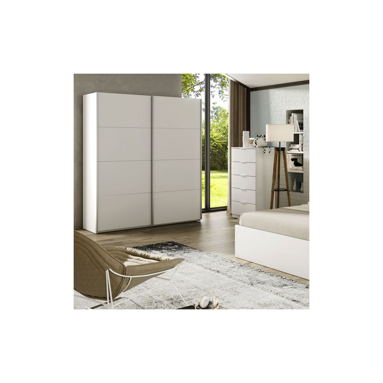 Un dormitorio con armario blanco, cómoda, cama y sillón.