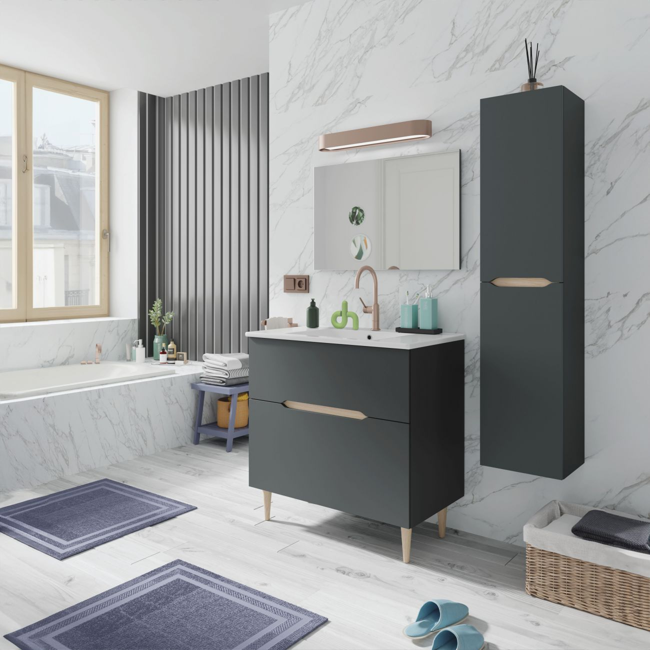 Baño moderno con tocador oscuro, bañera, espejo y dos alfombras azules.