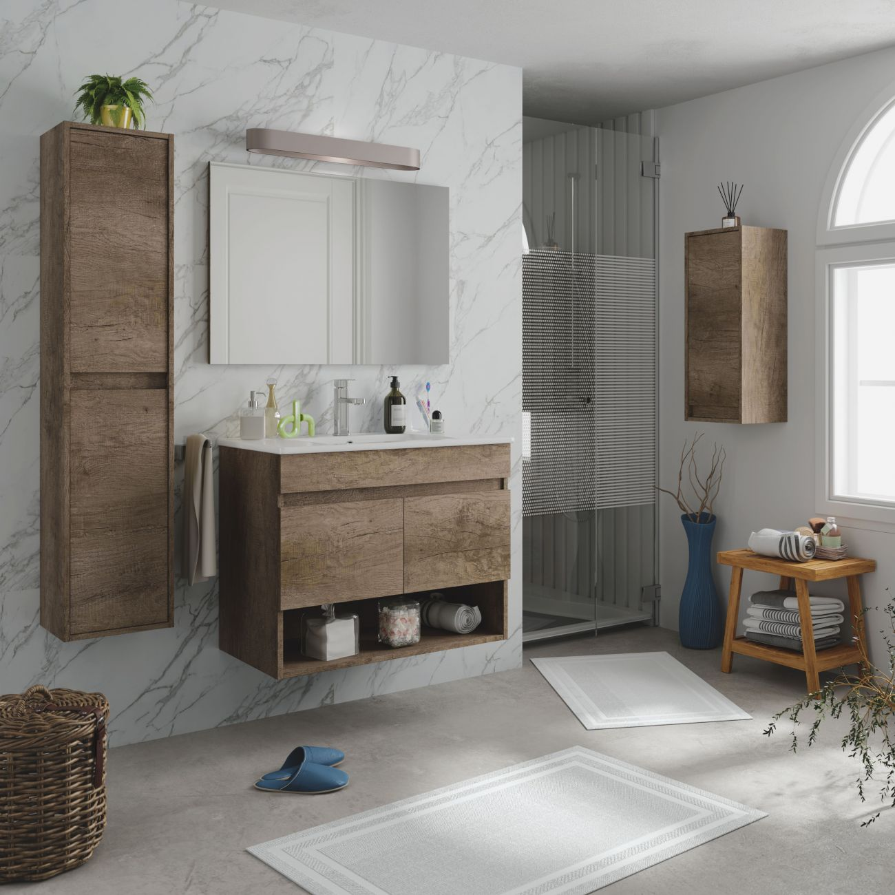 Baño moderno con elementos de madera, pared de mármol, ducha y tocador.