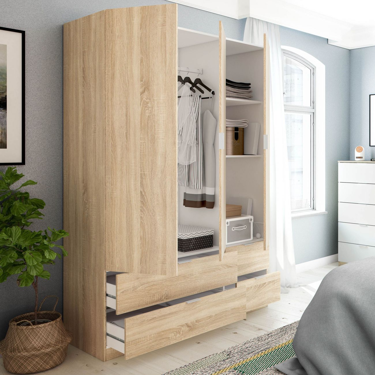 Un armario de madera abierto con ropa, cajones y cestas.