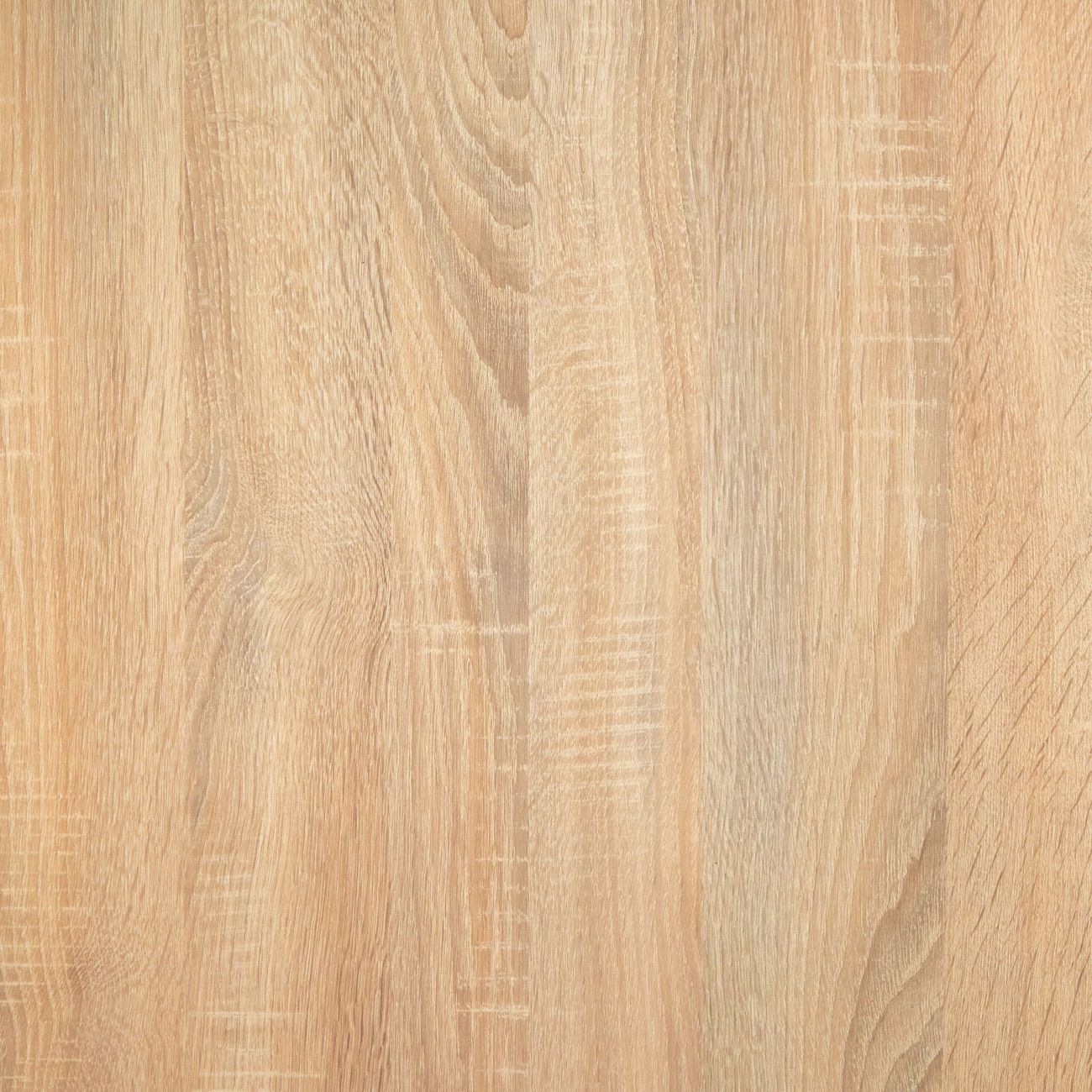 Un primer plano de madera clara con veta y líneas verticales.