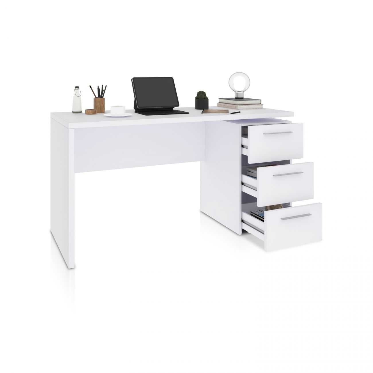 Un escritorio blanco con cajones abiertos, portátil, taza y material de oficina.