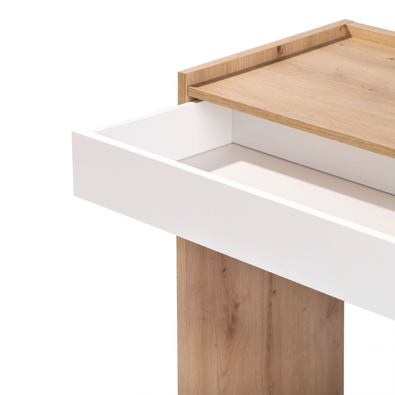 Un cajón blanco extraído junto a la pata de madera de una mesa.