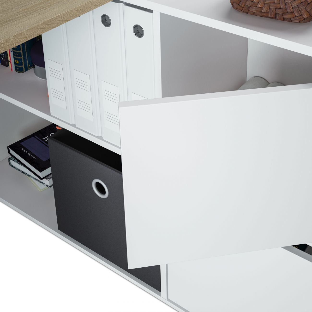Un estante blanco abierto con carpetas, libros y una caja de almacenamiento negra.