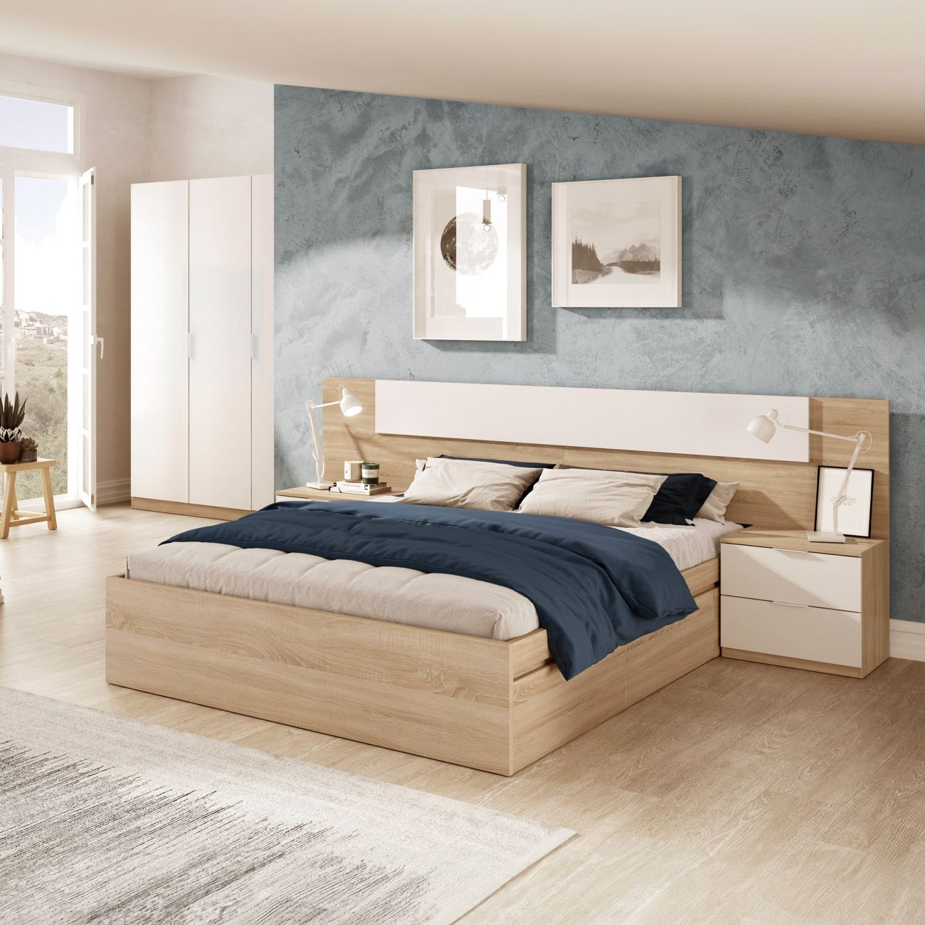 Dormitorio moderno con cama de madera, armarios blancos, lámparas y arte en la pared.