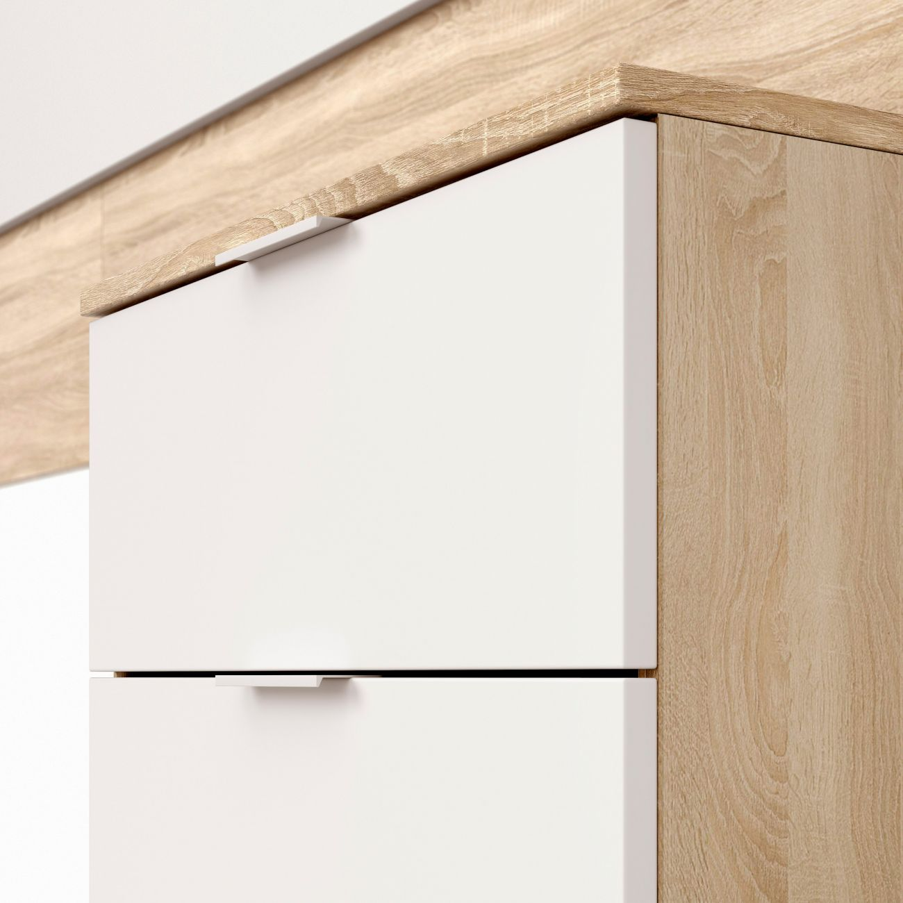 Cajones blancos con detalles de madera y tiradores minimalistas.