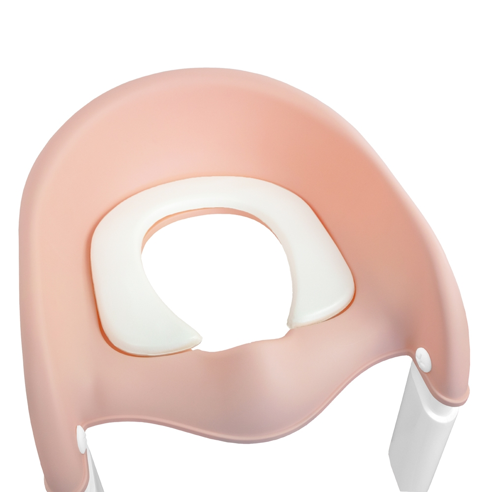 Un asiento de inodoro rosa para niños con acolchado blanco.