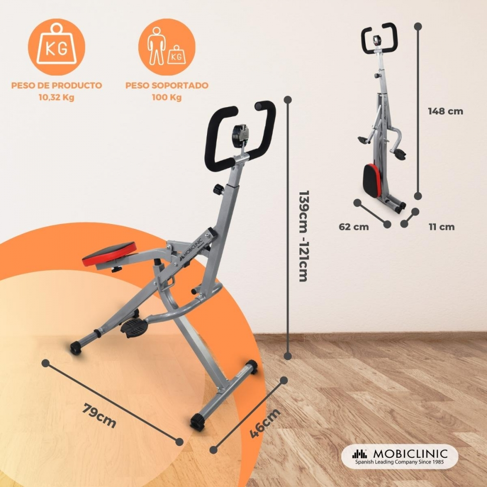 Máquina de fitness plateada con asiento y asas; se muestran las medidas.