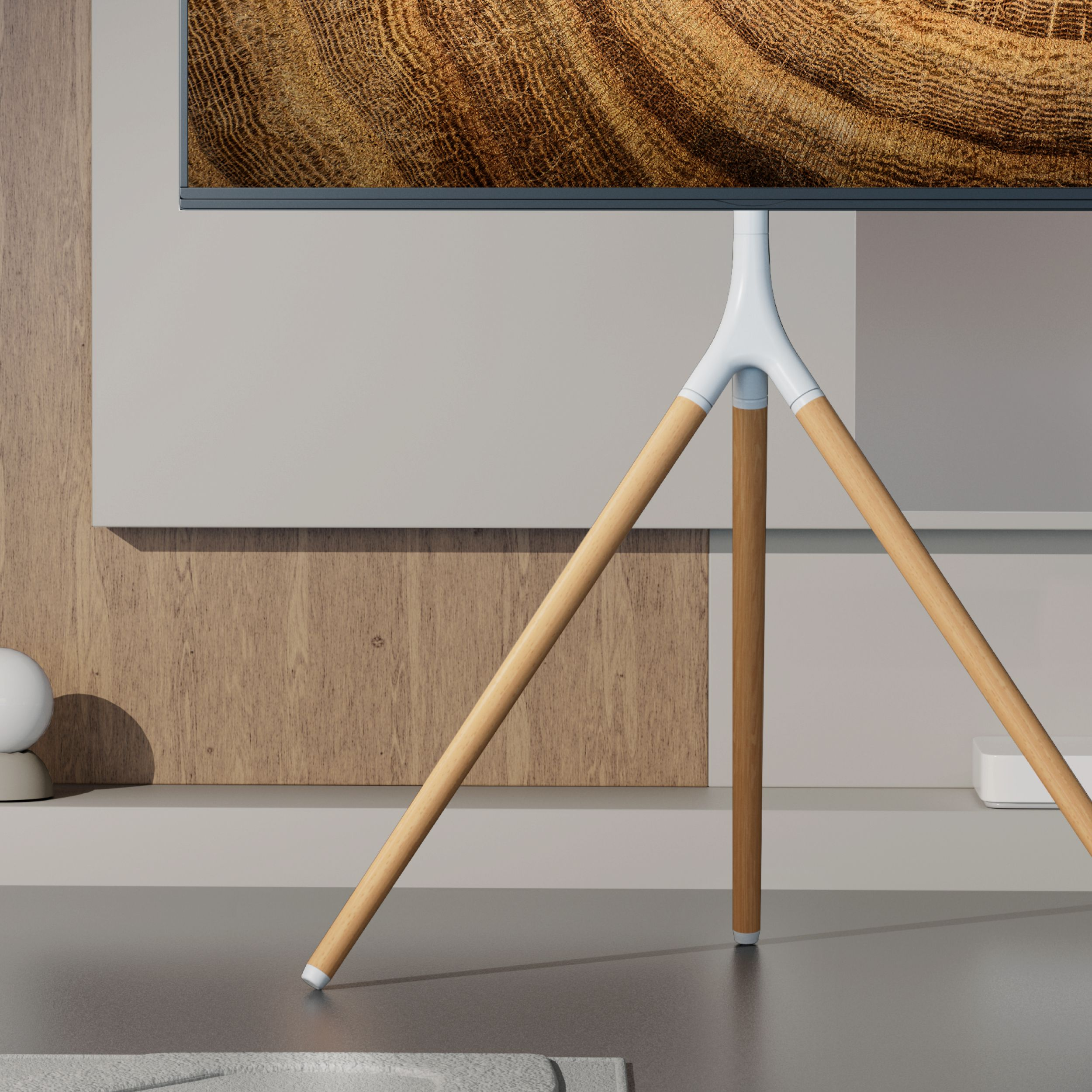 Nowoczesny telewizor z ekranem imitującym drewno i statywem.