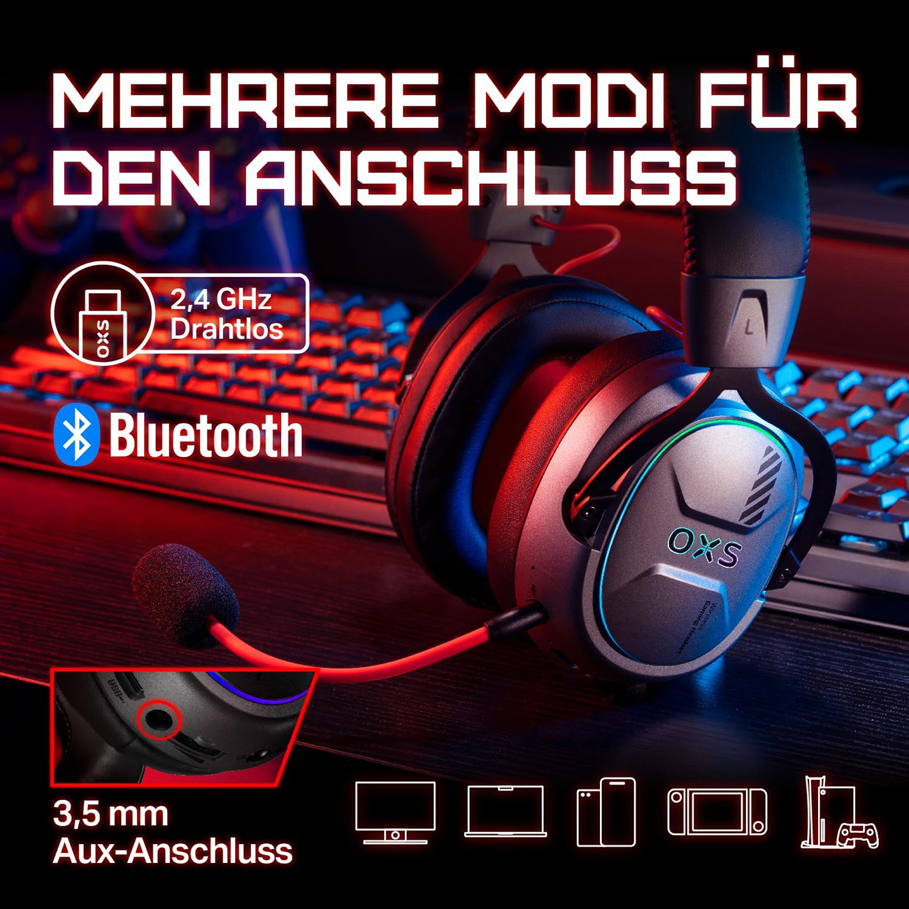 Grauer Kopfhörer mit Mikrofon auf Tastatur und Desktop.