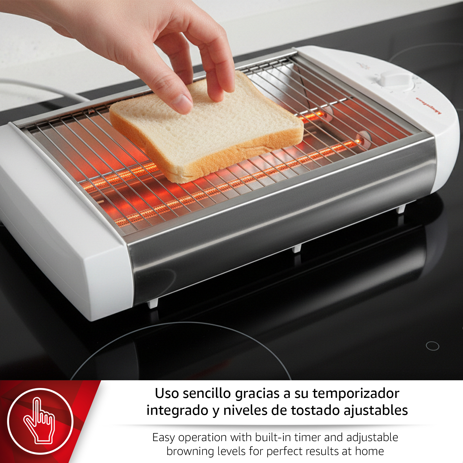 Una mano coloca una rebanada de pan en una tostadora con elementos calefactores.