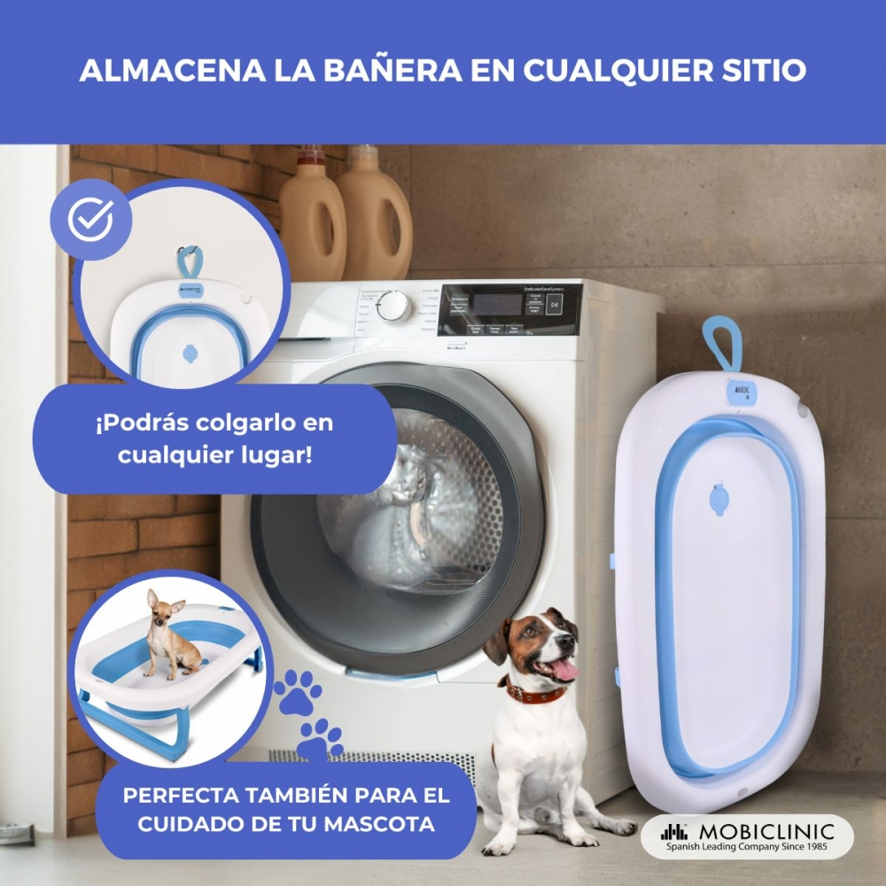 Una bañera de bebé plegable junto a una lavadora con perros.