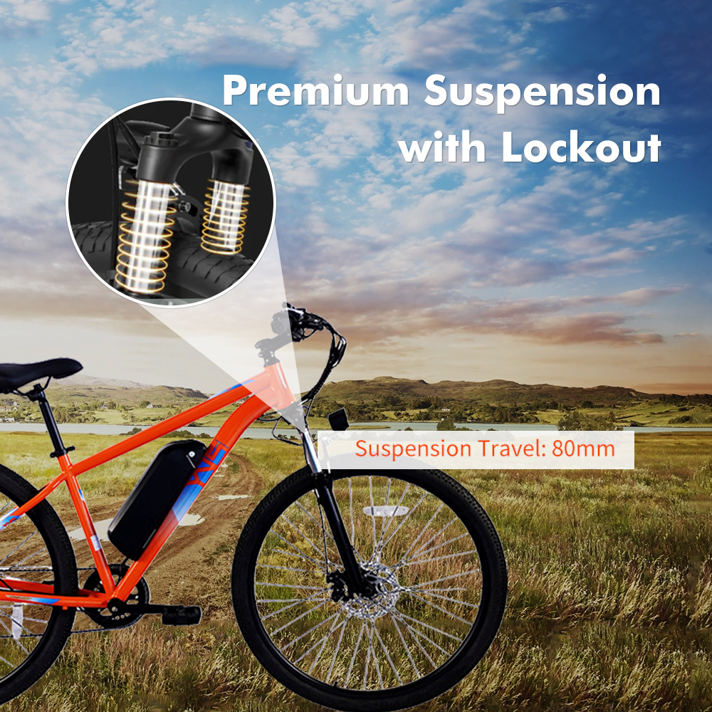 Pomarańczowy rower z amortyzacją i baterią na zewnątrz.