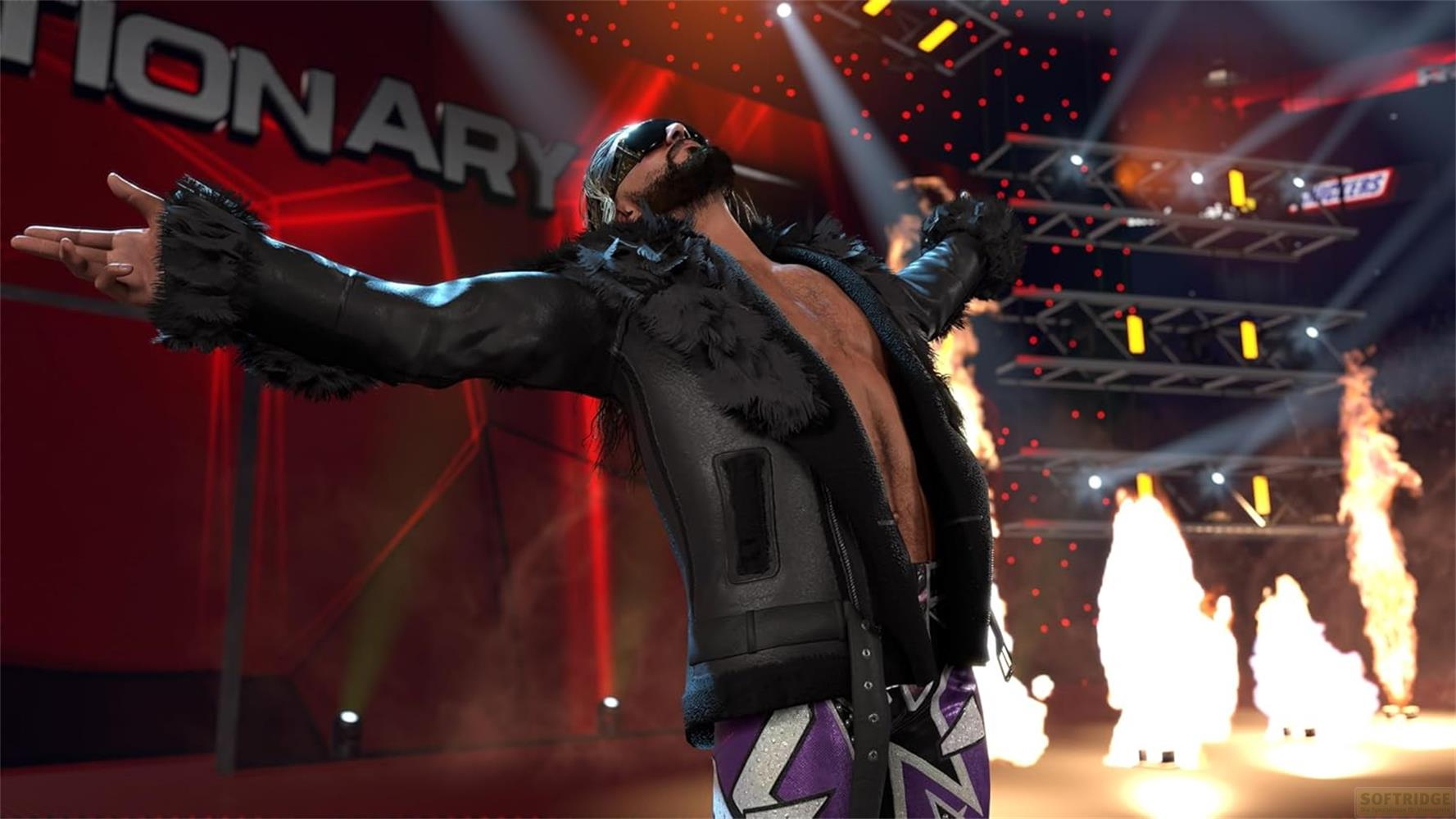 Ein Wrestler mit schwarzer Lederjacke und Fellkragen steht im Rampenlicht.