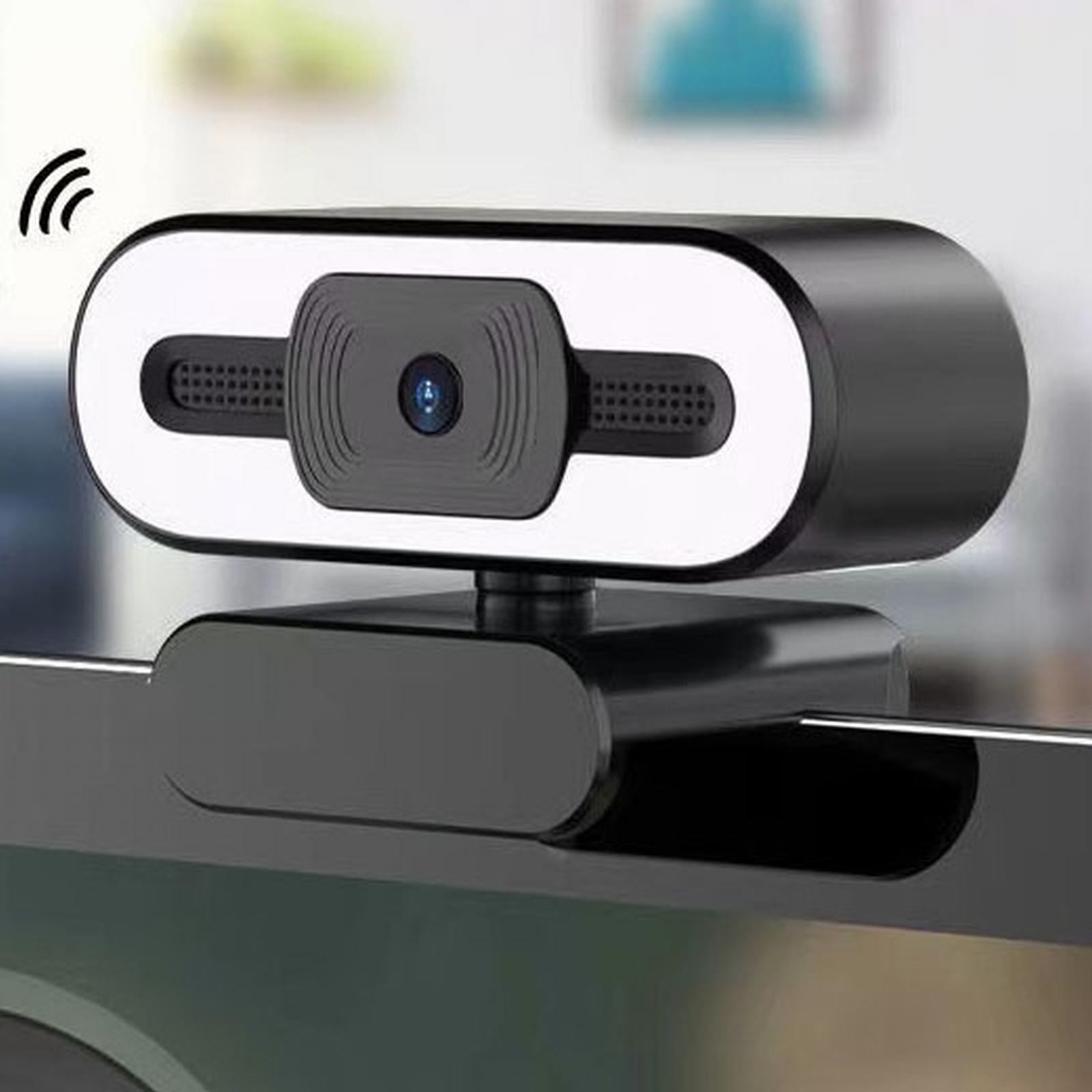 Eine schwarze Webcam mit WLAN-Symbol, auf einem Monitor montiert.