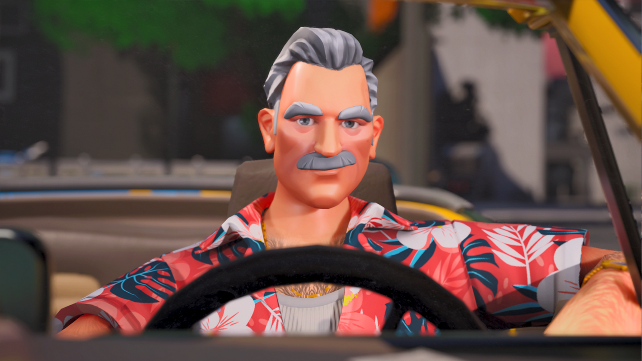 Un uomo con capelli grigi e baffi guida un'auto. Indossa una camicia colorata.